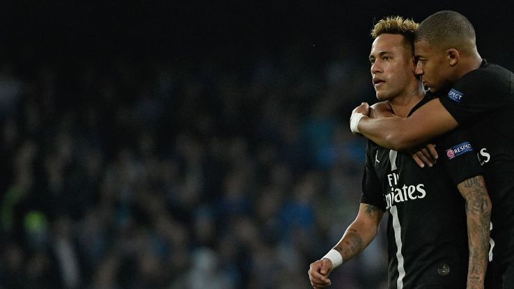 Neymar and Kylian Mbappe look on during Paris Saint-Germain's Champions League match at Napoli.