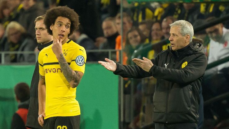 Witsel, left, credits the work of Favre, right, for Dortmund's rapid resurgence and current lead in the Bundesliga.