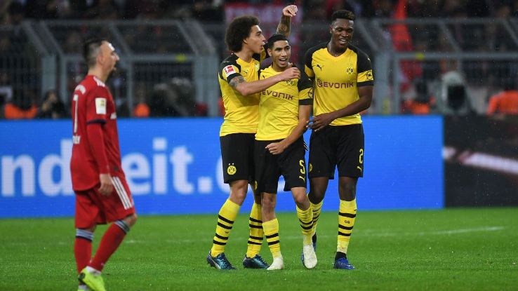 Borussia Dortmund players celebrate during their Bundesliga win over Bayern Munich.