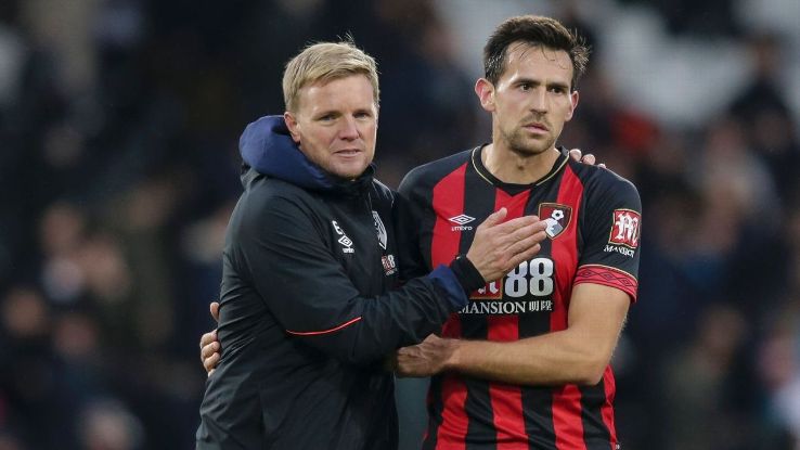 Eddie Howe, left, and Charlie Daniels leave the pitch after Bournemouth's 3-0 win against Fulham in October.