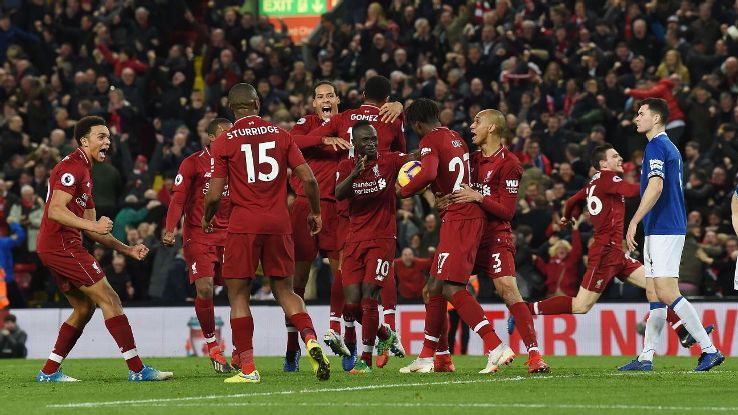 Liverpool celebrate after Divock Origi's last-minute goal handed them victory in one of the wildest Merseyside derby finishes ever.