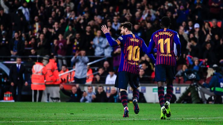 Lionel Messi, left, celebrates after scoring a goal for Barcelona against Celta Vigo.