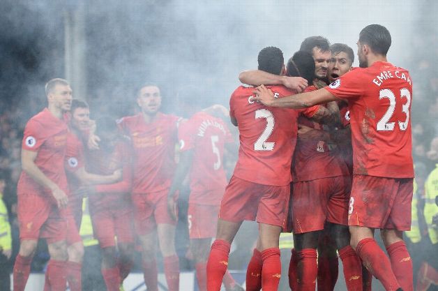 Liverpool players celebrate with Daniel Sturridge and Sadio Mane after the winning goal.
