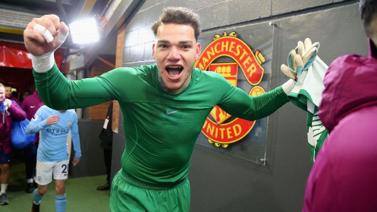 Ederson celebrates Manchester City's victory over Manchester United.