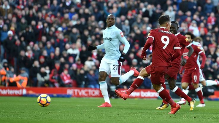 Liverpool's Roberto Firmino looks other way as he scores vs West Ham