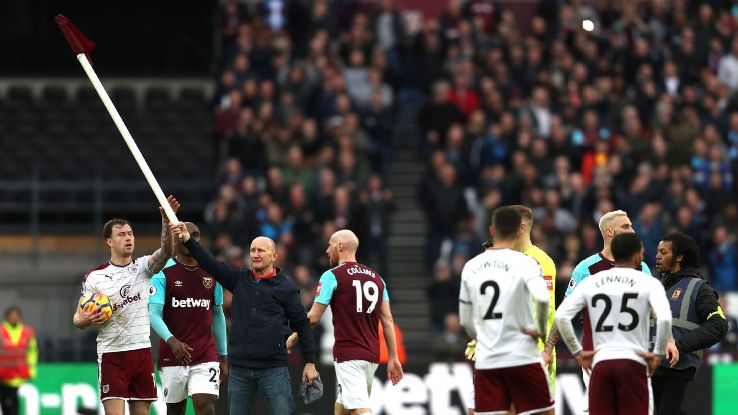 A West Ham supporter took the corner flag into the field of play during the Premier League game against Burnley.