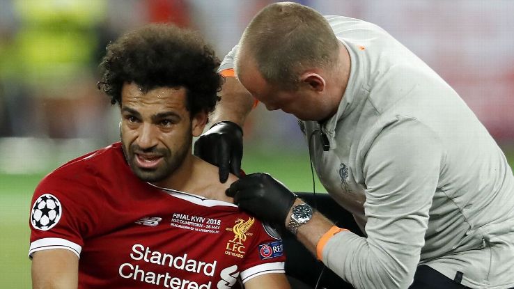 Mohamed Salah has his shoulder injury treated during Liverpool's Champions League final defeat against Real Madrid.
