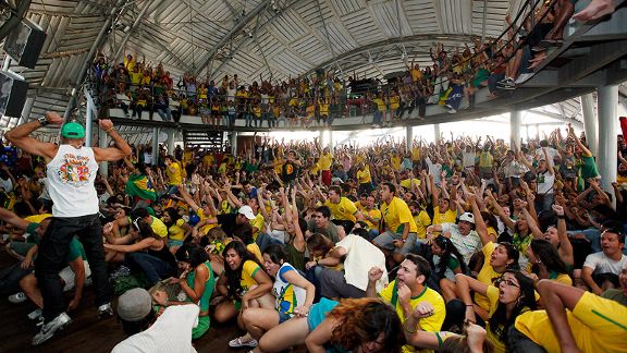 Brazilian supporters in Rio de Janeiro watch their team defeat Chile in the World Cup. 