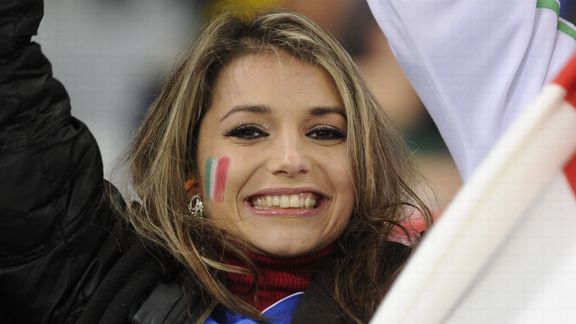 An Italy supporter cheers prior to the start of the Italy match