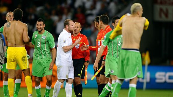 Wayne Rooney speaks to referee Ravshan Irmatov at the end of the game