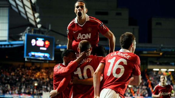 Rio Ferdinand celebrates with Wayne Rooney
