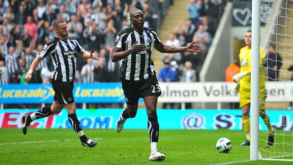 Shola Ameobi celebrates after opening the scoring from the penalty spot