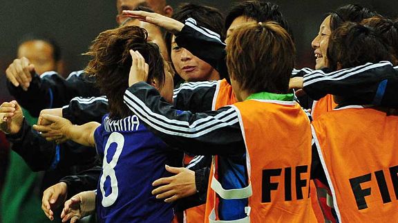 Rising sun strikes: Japan's players and staff celebrate Aya Miyama's equaliser
