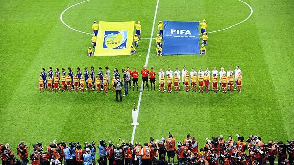 The teams hear their respective national anthems on the pitch in Frankfurt