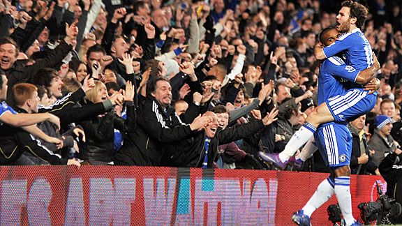 Florent Malouda celebrates with Juan Mata, scorer of the opening goal for Chelsea against Portsmouth.