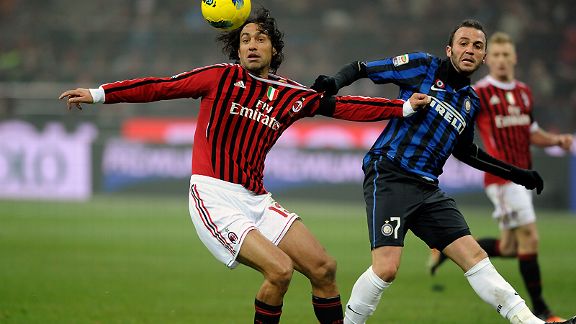 Alessandro Nesta does battle with Giampaolo Pazzini