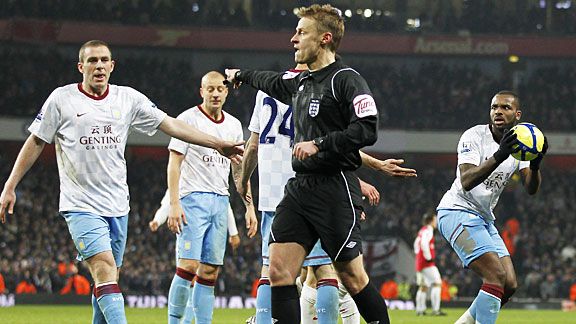 Darren Bent insists he won the ball as Mike Jones points to the spot for Arsenal's decisive penalty.