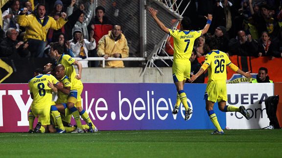 Apoel's players celebrate Gustavo Manduca's goal against Lyon.