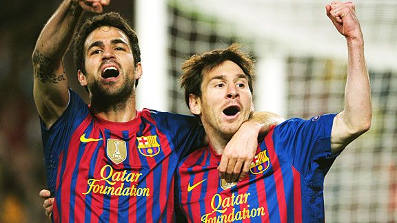 Cesc Fabregas and Lionel Messi celebrate