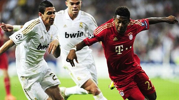 Angel di Maria and David Alaba battle for the ball.