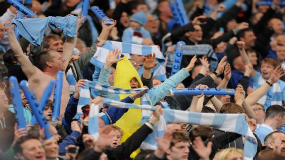 Manchester City fans celebrate their 1-0 victory amid jubilant scenes