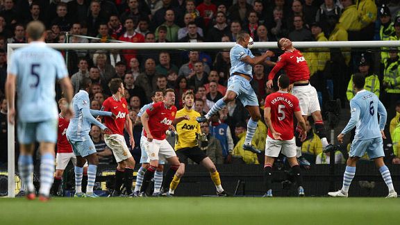Vincent Kompany heads City into the lead