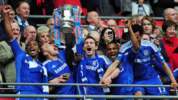 Chelsea players celebrate lifting the FA Cup after beating Liverpool