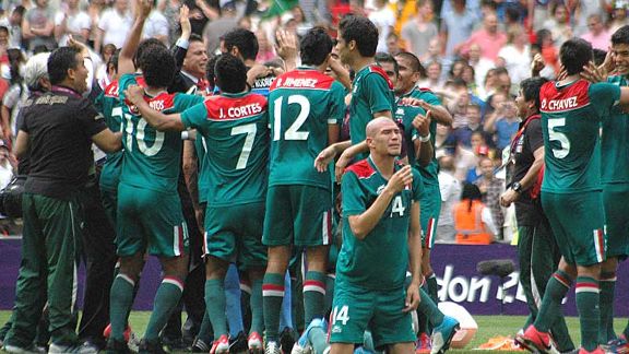 Going for gold: Mexico's players celebrate their famous victory