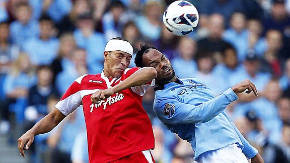 QPR goalscorer Bobby Zamora battles with Joleon Lescott