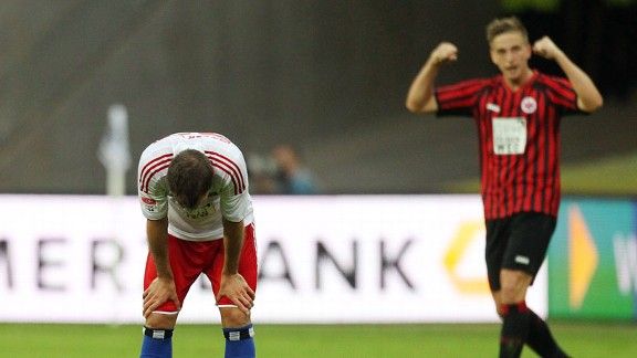 Rafael van der Vaart shows his frustration as Frankfurt's Bastian Oczipka celebrates victory