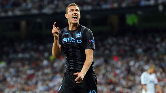 Edin Dzeko celebrates after firing Manchester City into the lead at the Bernabeu