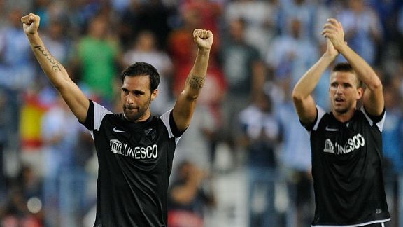 Jesus Gamez and Ignacio Camacho celebrate Malaga's victory