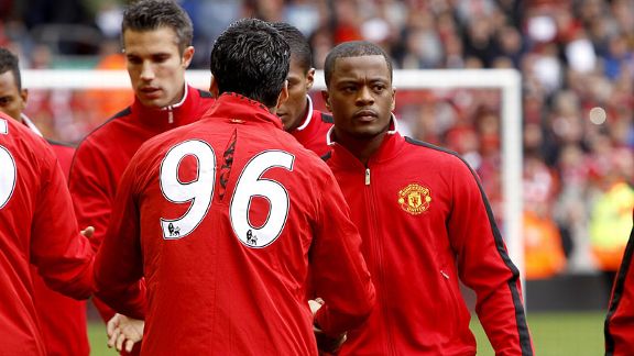 Luis Suarez and Patrice Evra