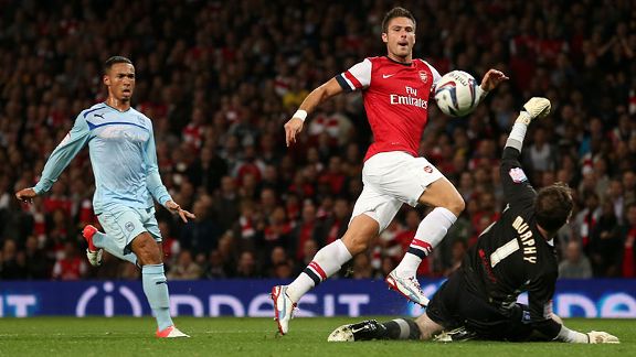 Olivier Giroud of Arsenal scores his first goal for the club