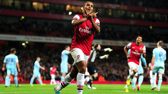 Arsenal's Theo Walcott celebrates scoring his side's sixth goal of the game