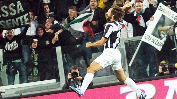 Andrea Pirlo celebrates after netting against Roma