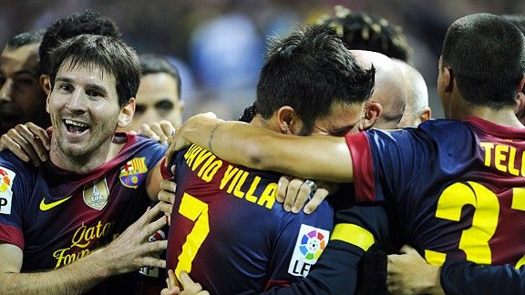 Barcelona celebrate David Villa's late, late winner at Sevilla