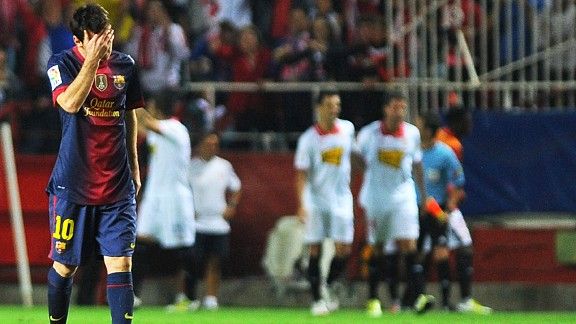 Lionel Messi hides his face as Sevilla race into a two goal lead against Barcelona