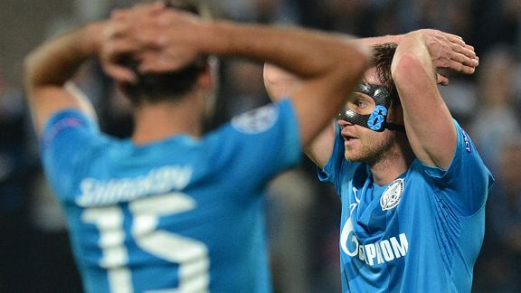 Nicolas Lombaerts of Zenit St. Petersburg reacts atfre losing to AC Milan