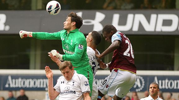Hugo Lloris punches clear on his Premier League debut
