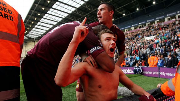 Edin Dzeko celebrates his dramatic late winner at West Brom