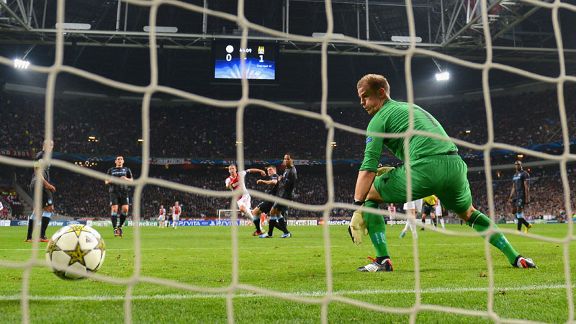 Joe Hart looks on as Siem de Jong's effort finds the back of the net