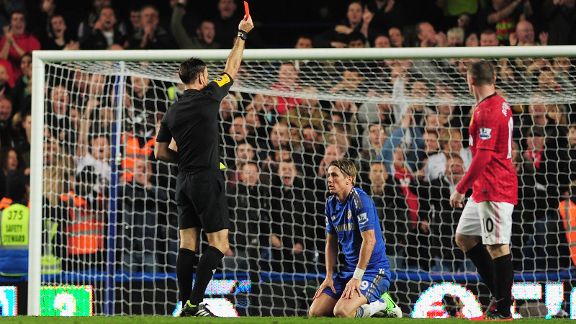 Referee Mark Clattenburg gives Fernando Torres his marching orders