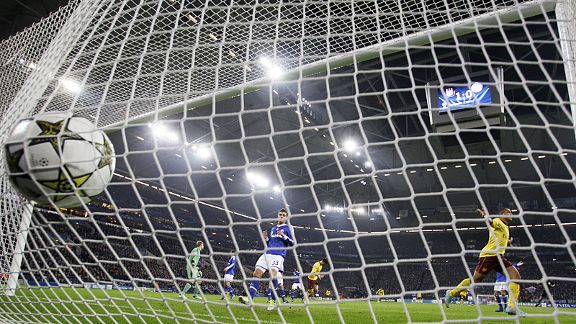 Theo Walcott turns to celebrate after scoring Arsenal's opener away to Schalke