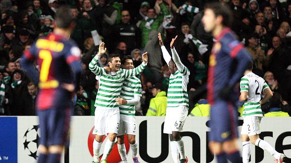 Celtic celebrate Tom Watt's goal as Barcelona wait to get the match restarted