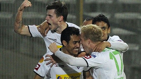 Borussia Monchengladbach's Juan Arango is congratulated on his late equaliser against Marseille
