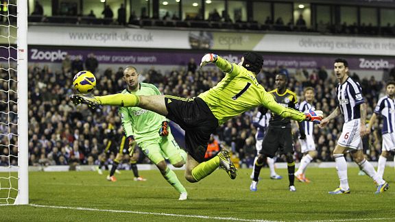 Petr Cech acrobatically tries to keep the ball in play when up for a corner at West Brom