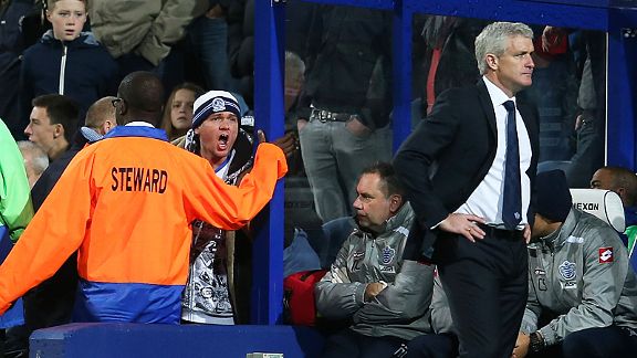 A QPR fan shouts at Mark Hughes as the struggling London club slip to a home defeat against Southampton
