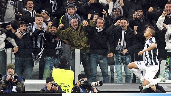 Artur Vidal celebrates with the crowd after scoring Juve's second against Chelsea