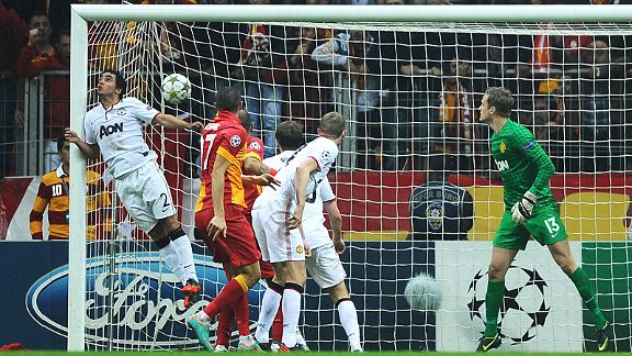 Rafael is unable to stop Burak Yilmaz's header from winning the game for Galatasaray against Manchester United